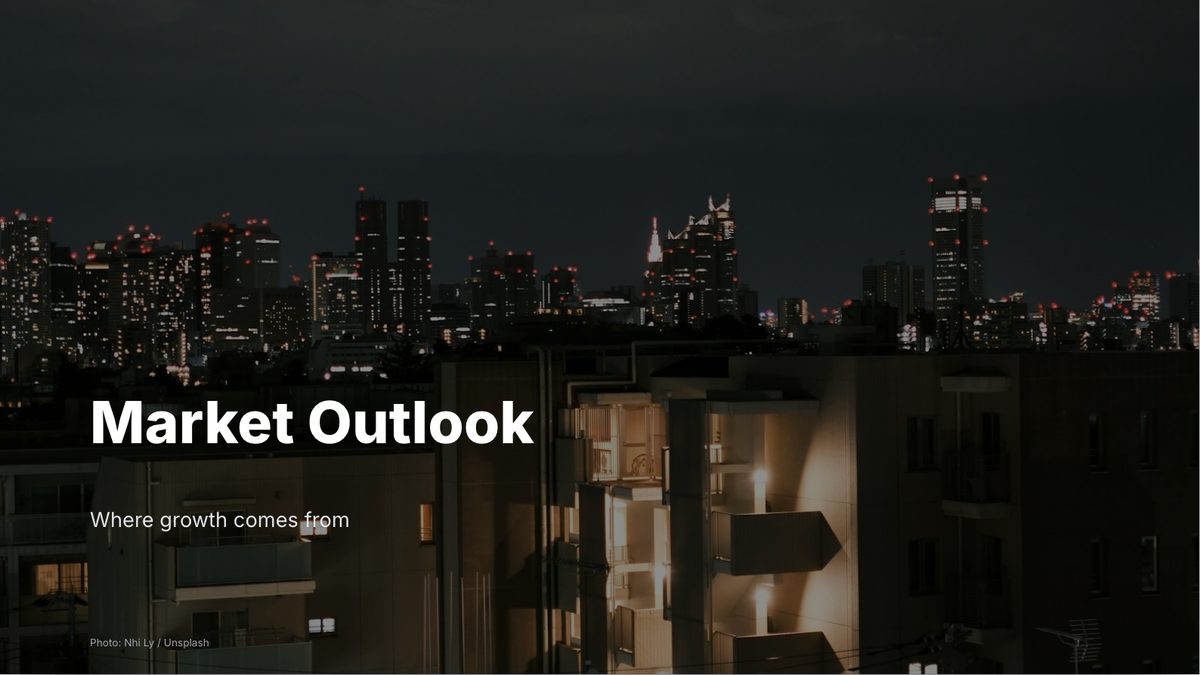 A title slide over a photograph of a city at night